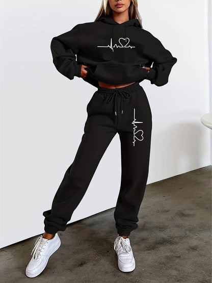 Produktbild von Damen Zweiteiler Cozy – Fleecegefütterter Hoodie & Jogginghose in Grau mit Herzschlag-Print, ideal für Herbst & Winter – hochwertig verarbeitet für tägliche Anwendung