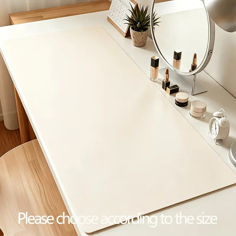 Cremefarbene schminktisch unterlage aus kunstleder mit glatter oberfläche und rundlichen ecken vanity pad wasserabweisend