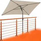 Beige balkon-sonnenschirm 200x125 cm uv50+ mit schwarzem metallgestell neben kupferfarbenem geländer online bestellen
