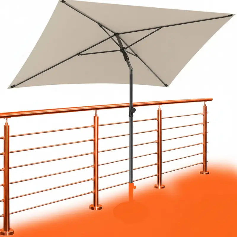 Beige balkon-sonnenschirm 200x125 cm uv50+ mit schwarzem metallgestell neben kupferfarbenem geländer online bestellen