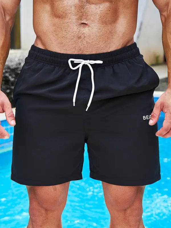 Schwarze herren badeshorts coco beach mit weißem kordelzug und dezentem bea-logo in regular fit
