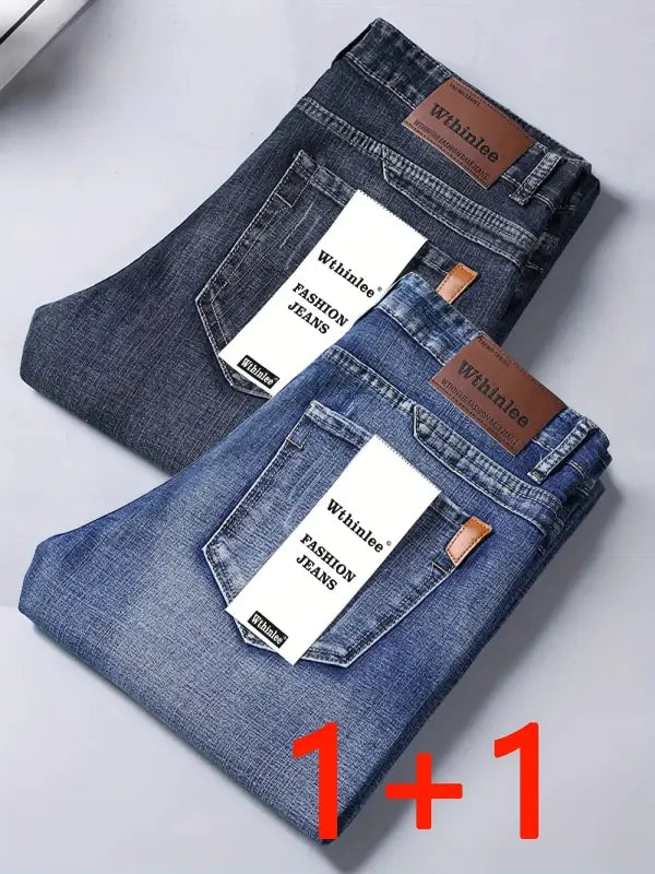 Dunkelblaue herren jeans loose fit straight leg mit braunen lederetiketten und weißen papieretiketten whinlee fashion jeans