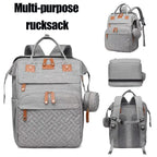 Grauer grovy eltern-rucksack aus gesteppter reißfestem material mit tan lederdetails und vielen fächern multifunktionale wickeltasche online bestellen