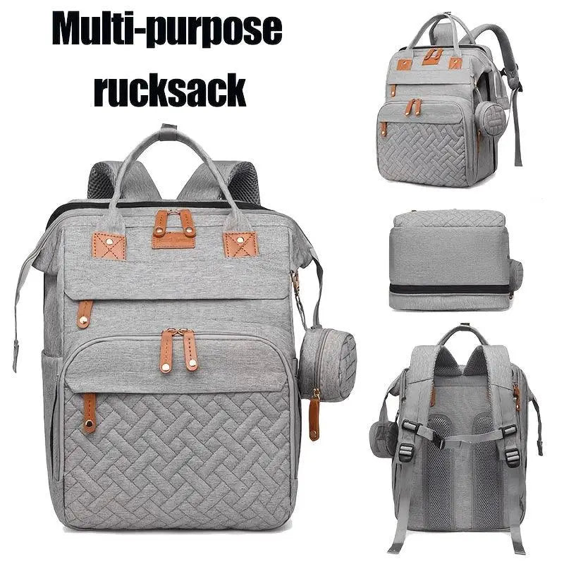 Grauer grovy eltern-rucksack aus gesteppter reißfestem material mit tan lederdetails und vielen fächern multifunktionale wickeltasche online bestellen