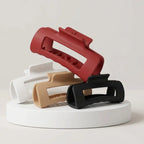 Set aus vier flexiblen silikon-haarklammern in rot, weiß, beige und schwarz als rutschfeste haarspange online bestellen