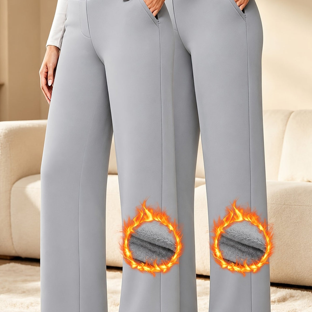 Zwei graue Damenhosen mit hohem Bund und weitem Bein sowie eingeblendeten Stoffdetails
