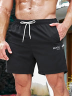 Schwarze herren badeshorts coco beach mit weißem kordelzug und beach cool branding regular fit