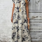 Offweißes damen blumenkleid kurzarm mit rundhals und zartem schwarzem blumenmuster maxi-sommerkleid