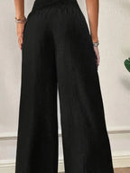 Schwarze wide leg schlaghose mit elastischem bund und feiner struktur im elegantes damen-zweiteiler-set online bestellen
